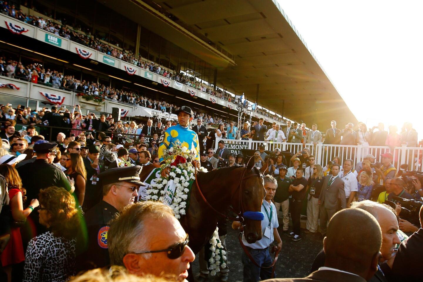 Victor Espinoza celebrates atop American Pharoah.