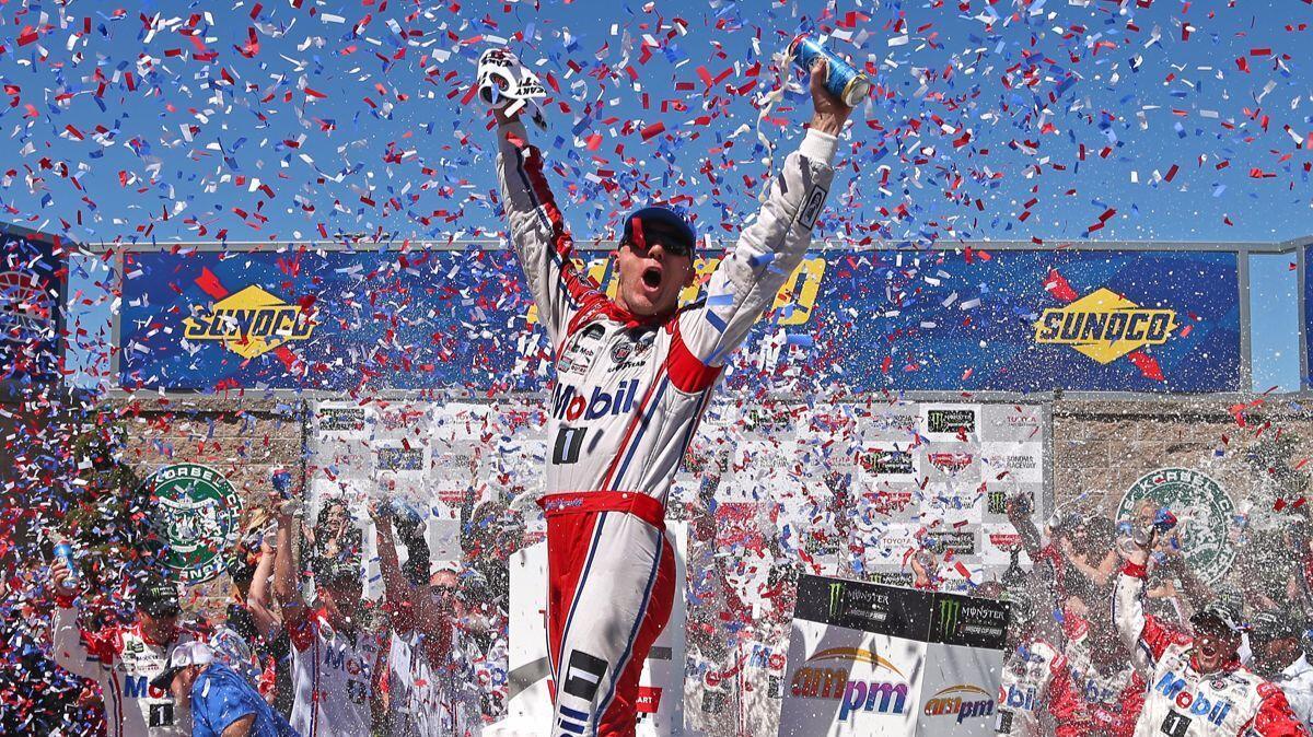 Kevin Harvick celebrates in victory lane after winning the Monster Energy NASCAR Cup Series Toyota/Save Mart 350 at Sonoma Raceway on Sunday.