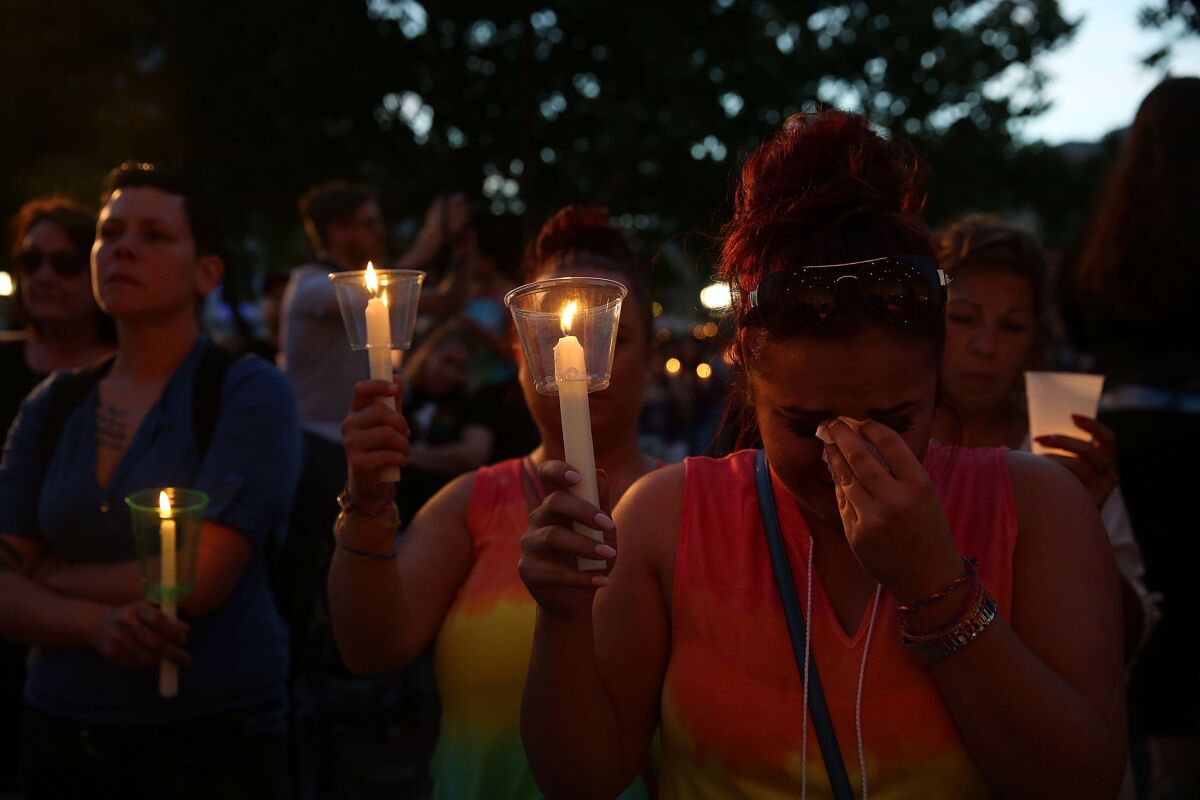 Thousands attend a candlelight vigil in an Orlando park Sunday night.