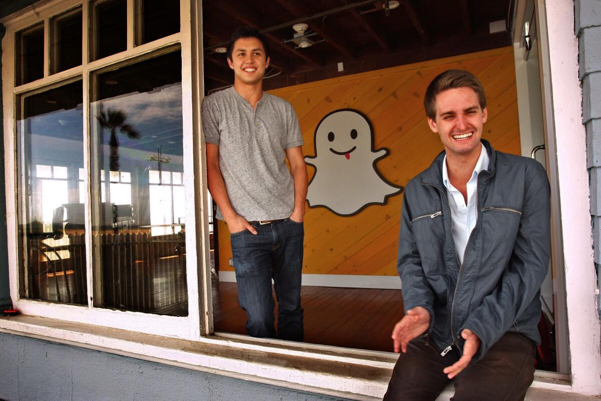 Bobby Murphy, 24, left, and Evan Spiegel, 22, co-creators of Snapchat, at the company's offices on Ocean Front Walk in Venice on May 6, 2013. Snapchat is a mobile app that allows users to capture videos and pictures that self-destruct after a few seconds.