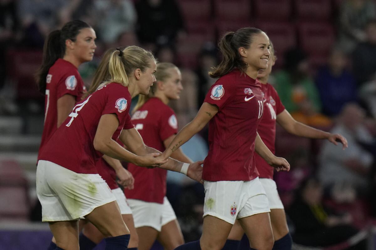Norway's Guro Reiten, right, celebrates after scoring her side's fourth goal on a free kick during the Women Euro 2022 soccer match between Norway and Northern Ireland, at the St.Mary's stadium, in Southampton, Thursday, July 7, 2022. (AP Photo/Alessandra Tarantino)