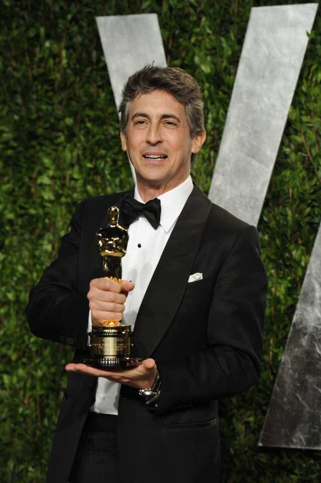 "The Descendants" director Alexander Payne shows off his Oscar for adapted screenplay.