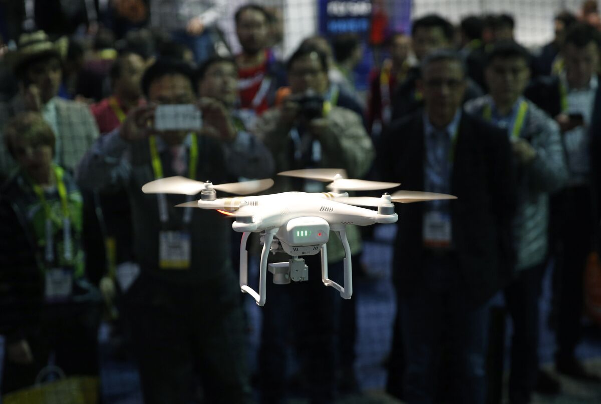 A drone hovers at the DJI booth during CES International on Jan. 7, 2016, in Las Vegas.