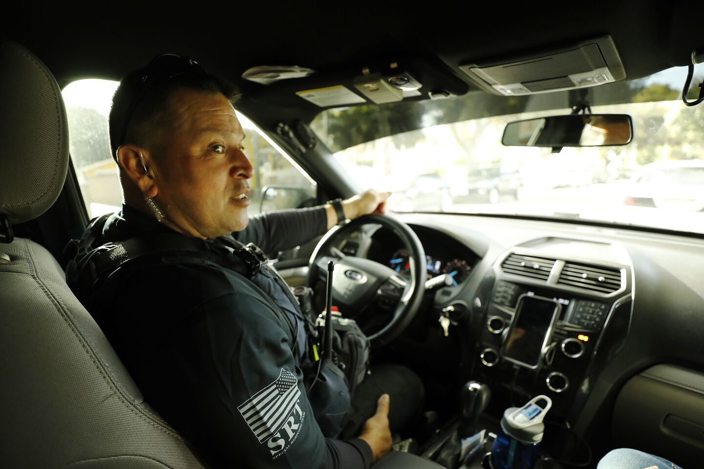 A law enforcement officer at the wheel