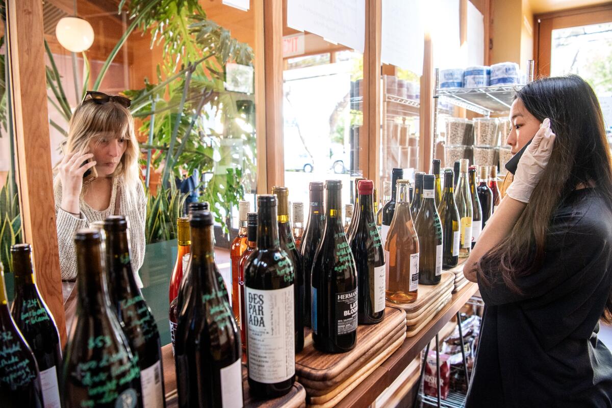 In Echo Park, Tilda employee Emily Koh takes an order from customer Claire Goldberg.