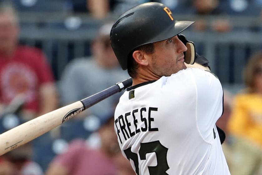 Pittsburgh Pirates' David Freese watches his two-run home run off New York Mets starting pitcher Steven Matz during the first inning of a baseball game in Pittsburgh, Thursday, July 26, 2018. (AP Photo/Gene J. Puskar)