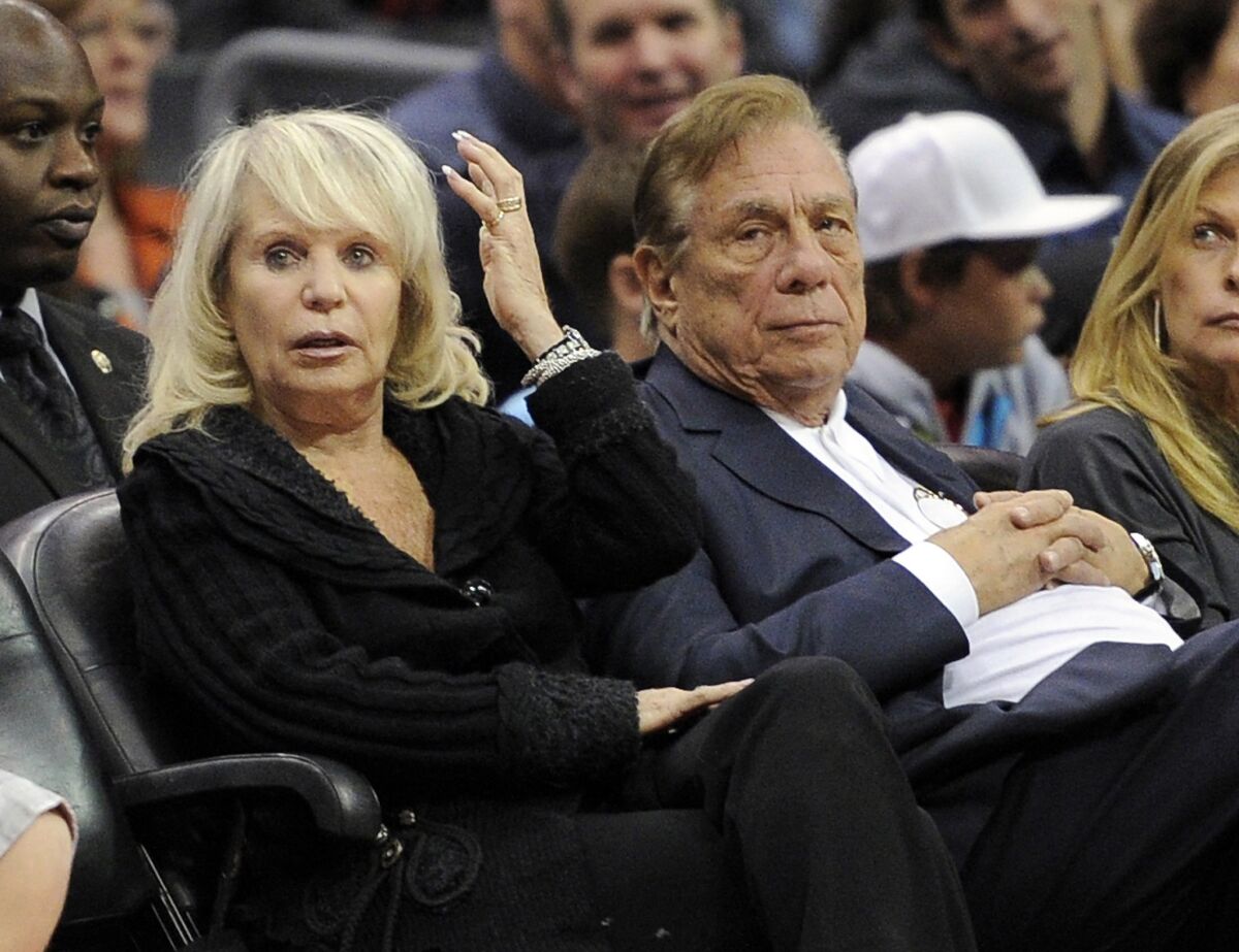 Shelly Sterling sits with her husband, then-Los Angeles Clippers owner Donald Sterling, at a Nov. 12, 2010, Clippers-Pistons game at Staples Center.