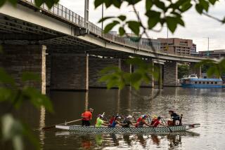 WASHINGTON, DC - JULY 10: The DC Dragon Boat Club practices in the Washington Channel near the DC Wharf on Sunday, July 10, 2022 in Washington, DC. (Kent Nishimura / Los Angeles Times)