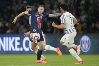 FILE - PSG's Milan Skriniar, left, is challenged by Toulouse's Zakaria Aboukhlal.