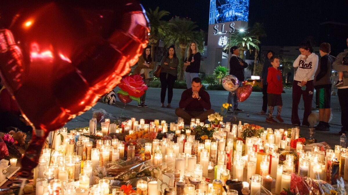 Mourners gather at a memorial for the victims of the Las Vegas massacre. More than thoughts and prayers will be needed to stop the next one.
