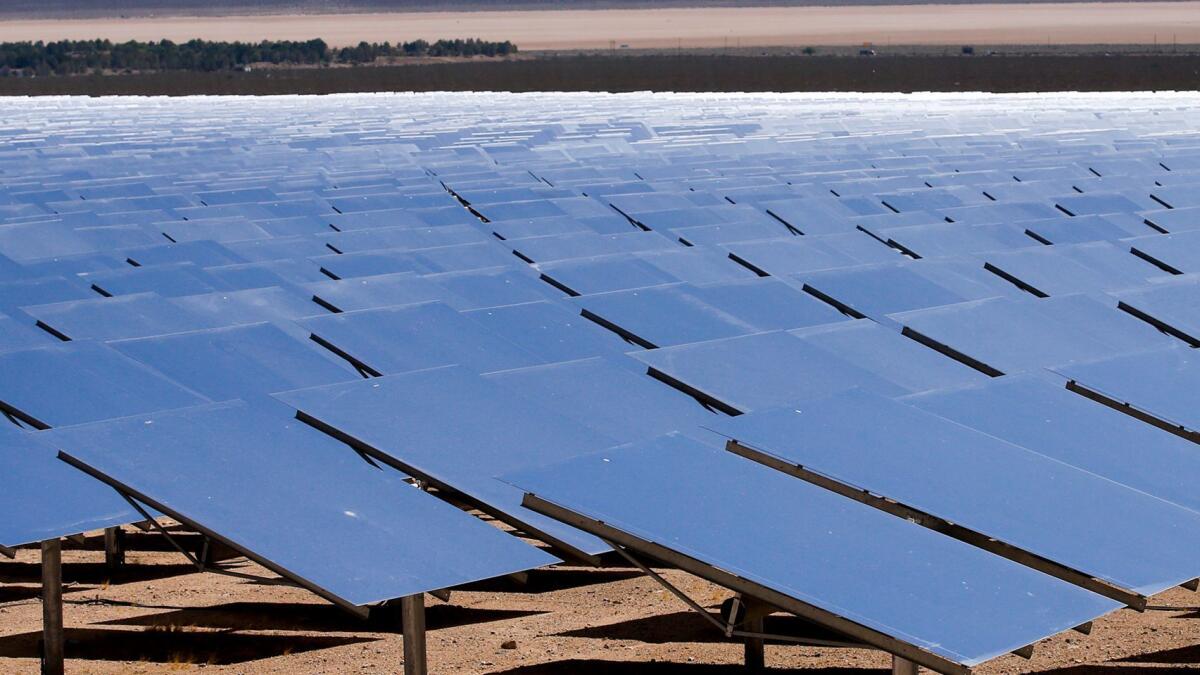 Thousands of solar units focus sunlight on a boiler to generate electricity at the Ivanpah Solar Power Station near the California-Nevada border. But can solar and other renewables make the U.S. 100% green?