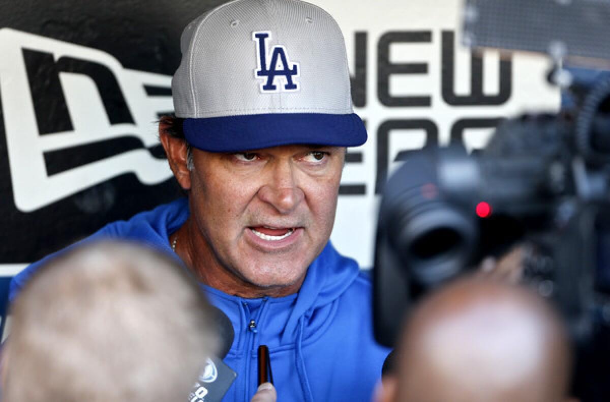 Dodgers Manager Don Mattingly holds a pregame chat with reporters before a game earlier this season in San Diego.