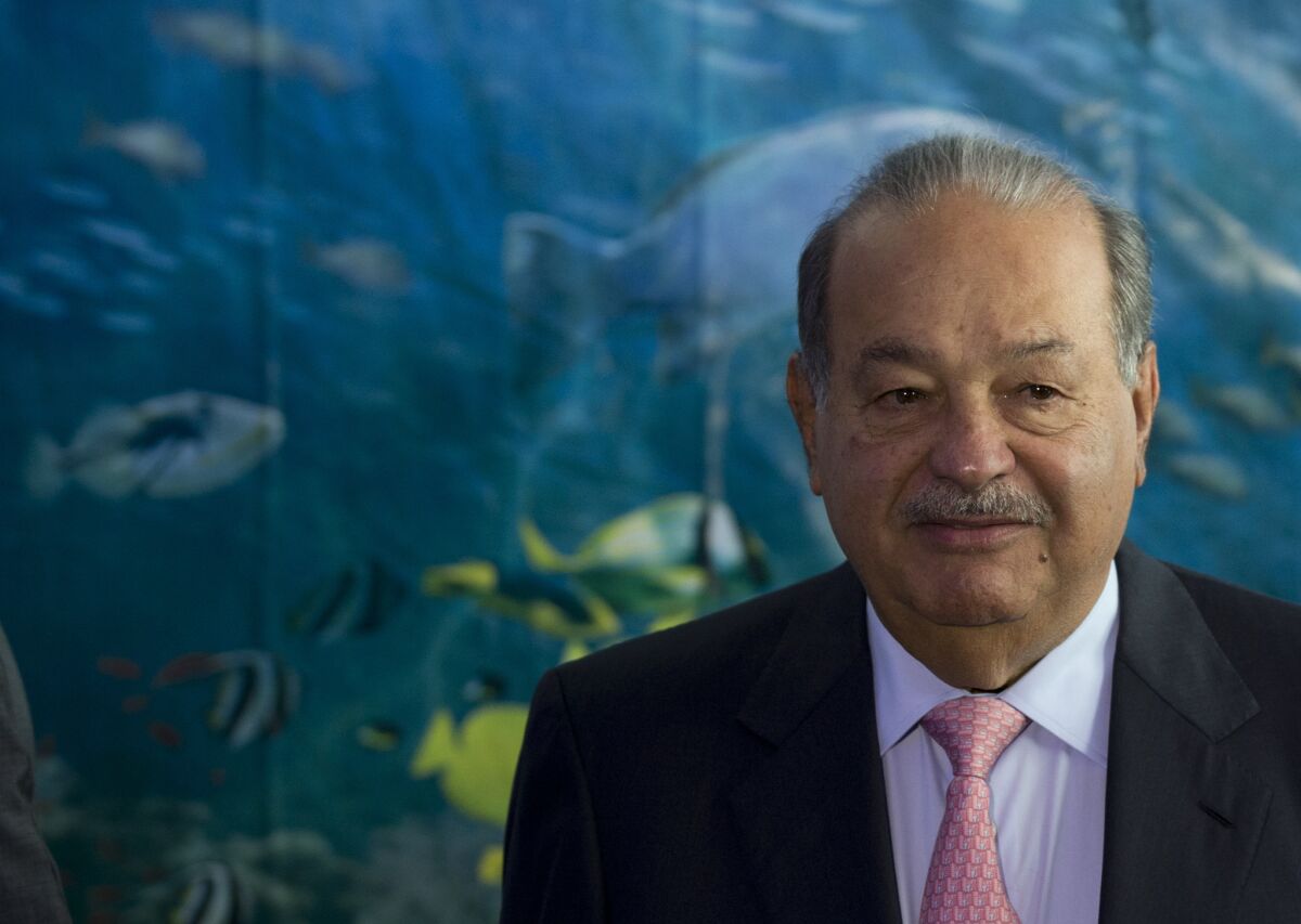 Carlos Slim, seen at the May 30 opening of the Inbursa Aquarium in Mexico City, plans to sell off part of his empire to avoid new telecommunications rules in Mexico.