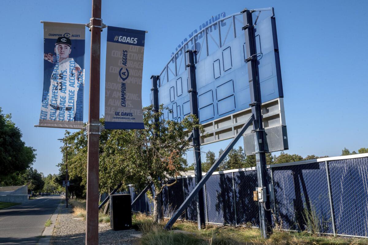 A poster displays a UC Davis baseball player outside the locked Swimley Field on Thursday, July 15, 2021, in Davis, Calif. UC Davis suspended its entire varsity baseball team and put the team's coaching staff on administrative leave Wednesday while it investigates unspecified allegations of misconduct. (Renee C. Byer/The Sacramento Bee via AP)