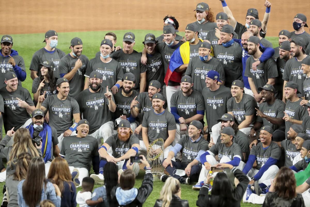 The Dodgers pose for a team photo after beating the Tampa Bay Rays to become World Series champions. 