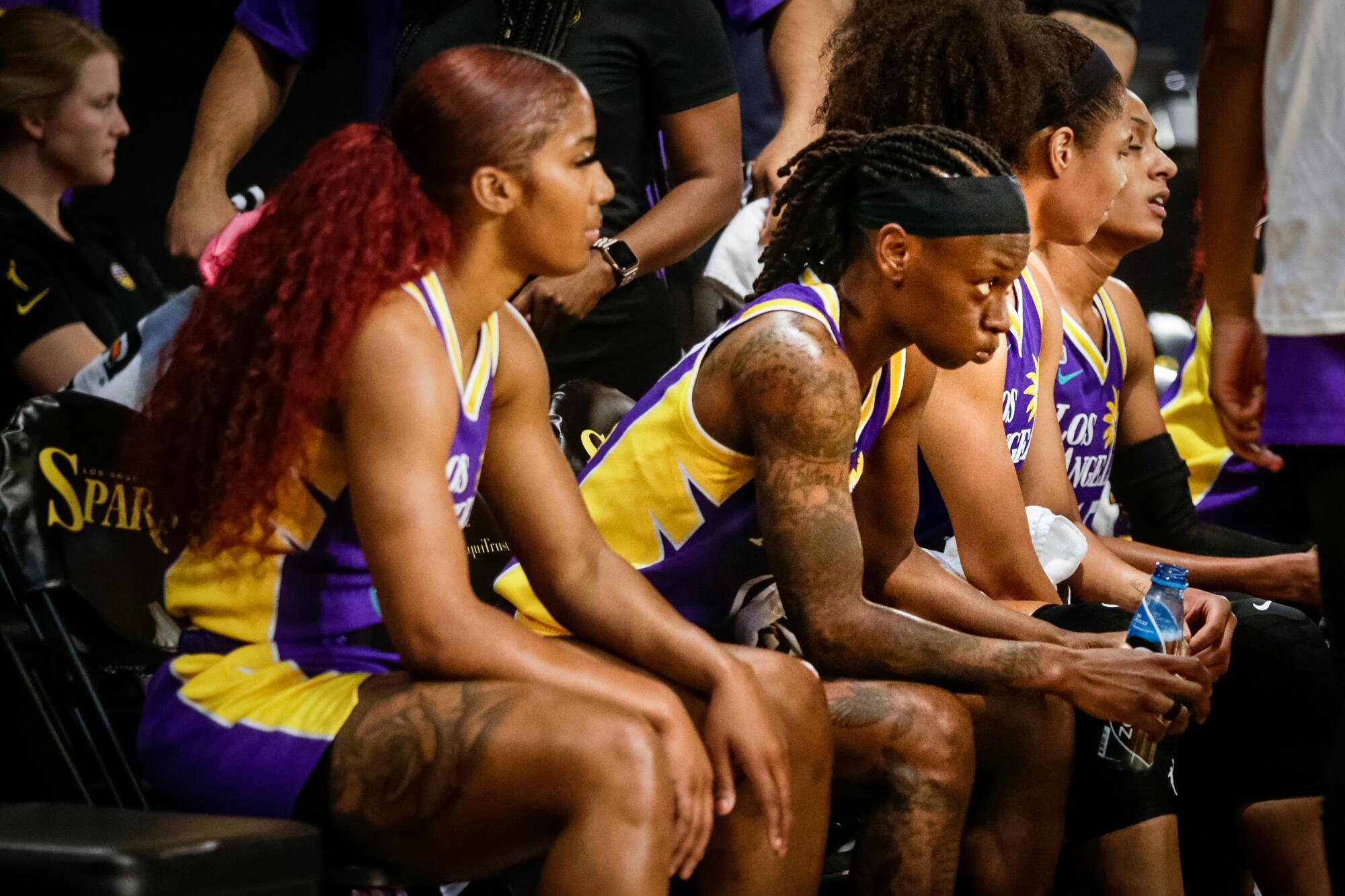 Sparks point guard Erica Wheeler takes a breather during a timeout in the game against the Las Vegas Aces.