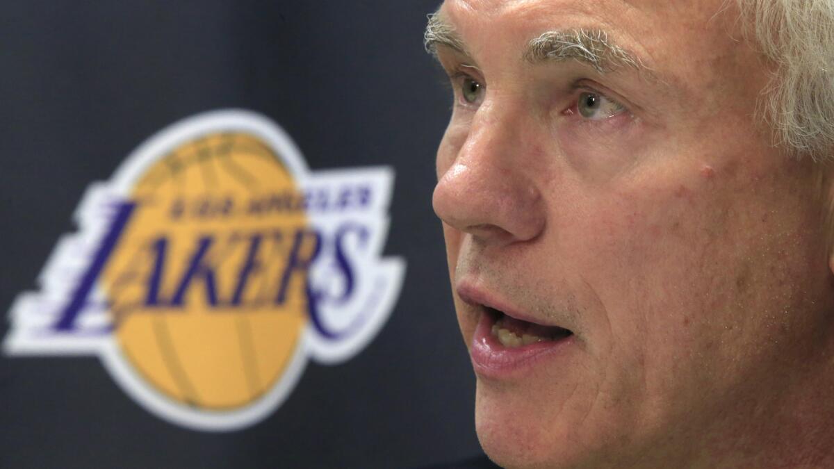 Lakers General Manager Mitch Kupchak answers questions during a news conference at the team's practice facility in El Segundo on Sept. 26, 2014.