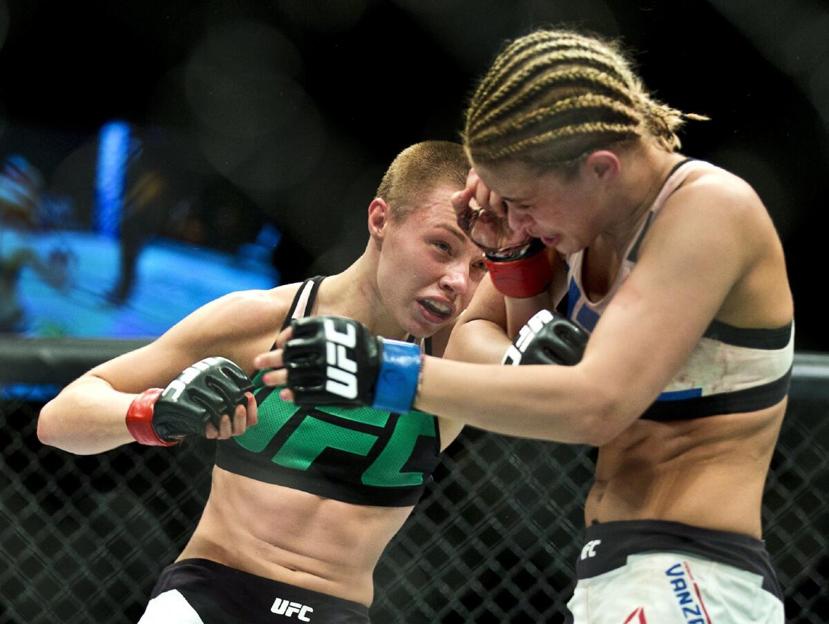 Rose Namajunas, left, connects to the head of Paige VanZant during a UFC Fight Night in Las Vegas on Thursday.