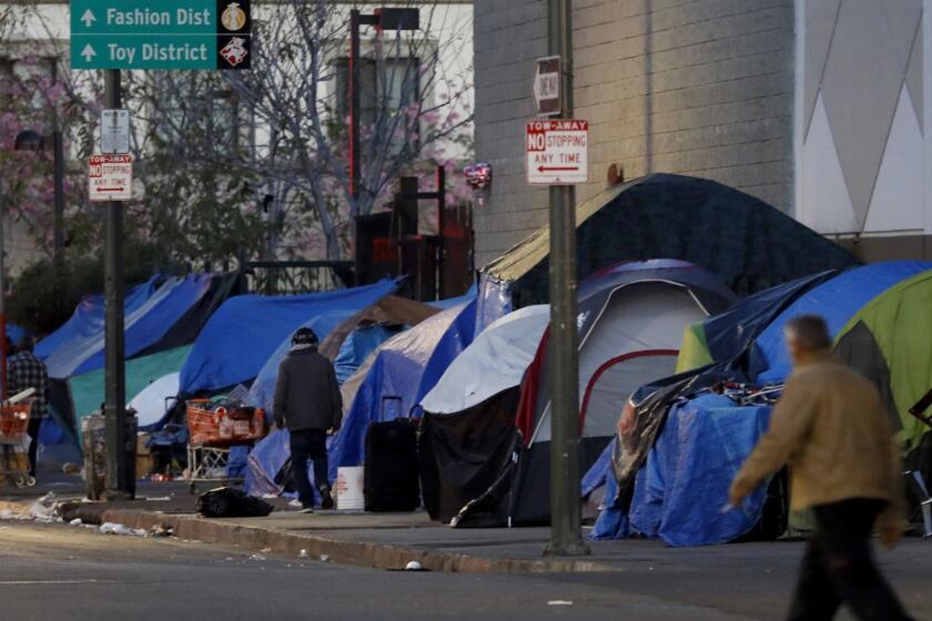 Los Angeles, CA February 15, 2018: The streets are lines with tents near East 5th Street and South San Pedro Street in the skid row area of Los Angeles, CA February 15, 2018. (Francine Orr/ Los Angeles Times) (**Editors Note*** This photo is to be used for an Op-Ed story on Homelessness. PLEASE DO NOT USE on another story or social before it is published for the intended story. If you have any questions contact photo editor Mary Cooney Mary.Cooney@latimes.com)
