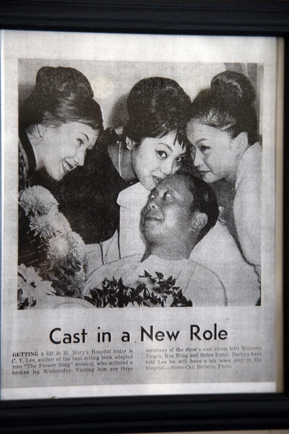 A framed newspaper clipping of three pretty girls kissing a much younger version of himself hangs in C.Y. Lee's home office in Little Ethiopia.