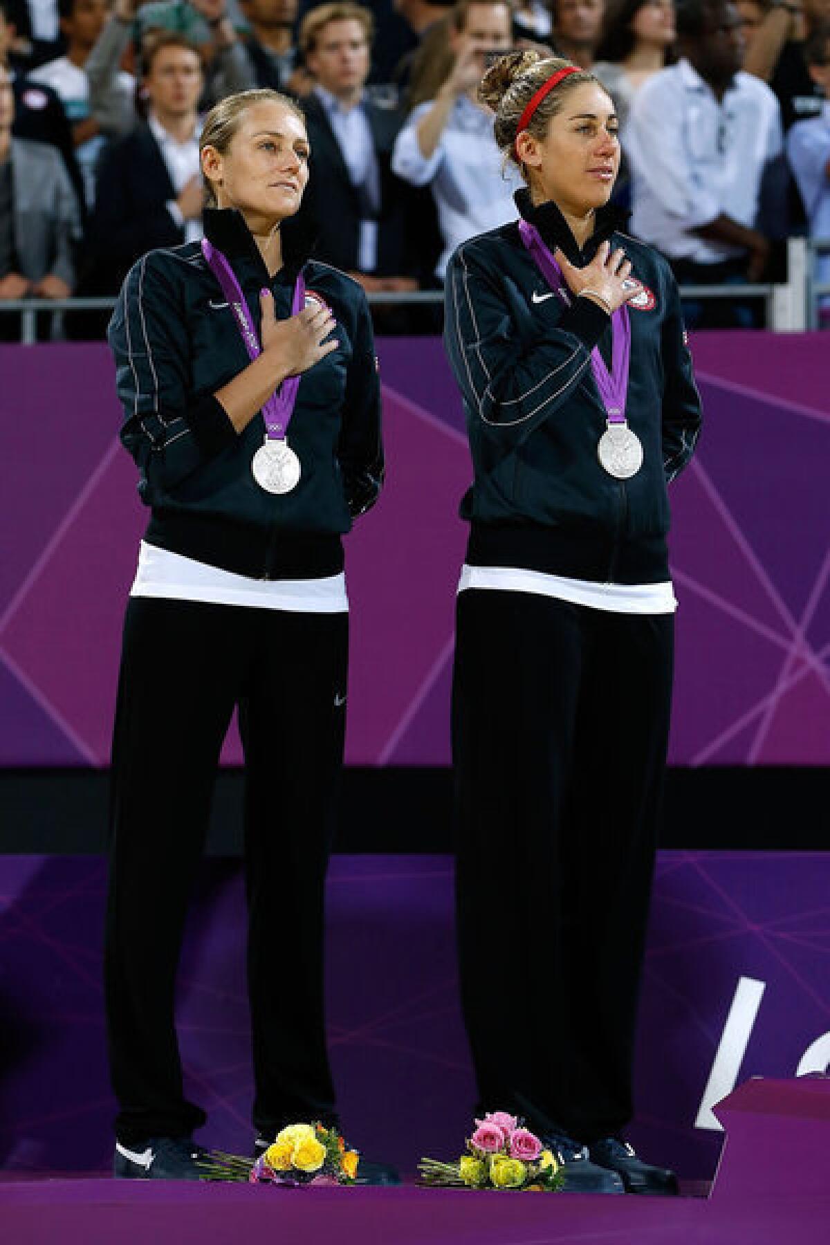 Silver medalists Jennifer Kessy and April Ross of the U.S. on the medal podium in London.