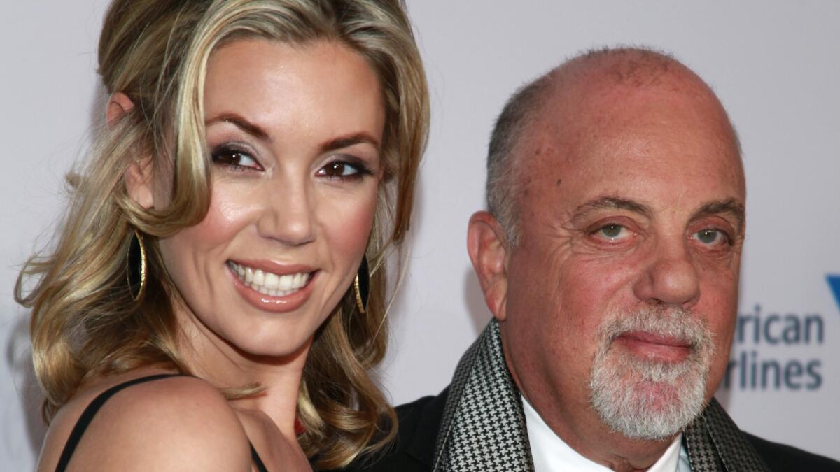 Alexis Roderick and Billy Joel, shown in 2013, got married in a surprise ceremony Saturday night during their annual July 4th party.