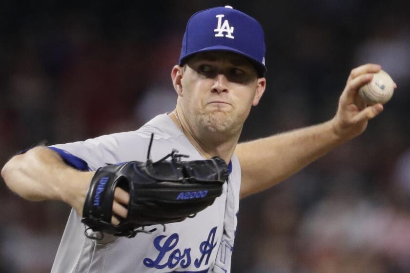 Los Angeles Dodgers starting pitcher Alex Wood throws against the Arizona Diamondbacks during the first inning.