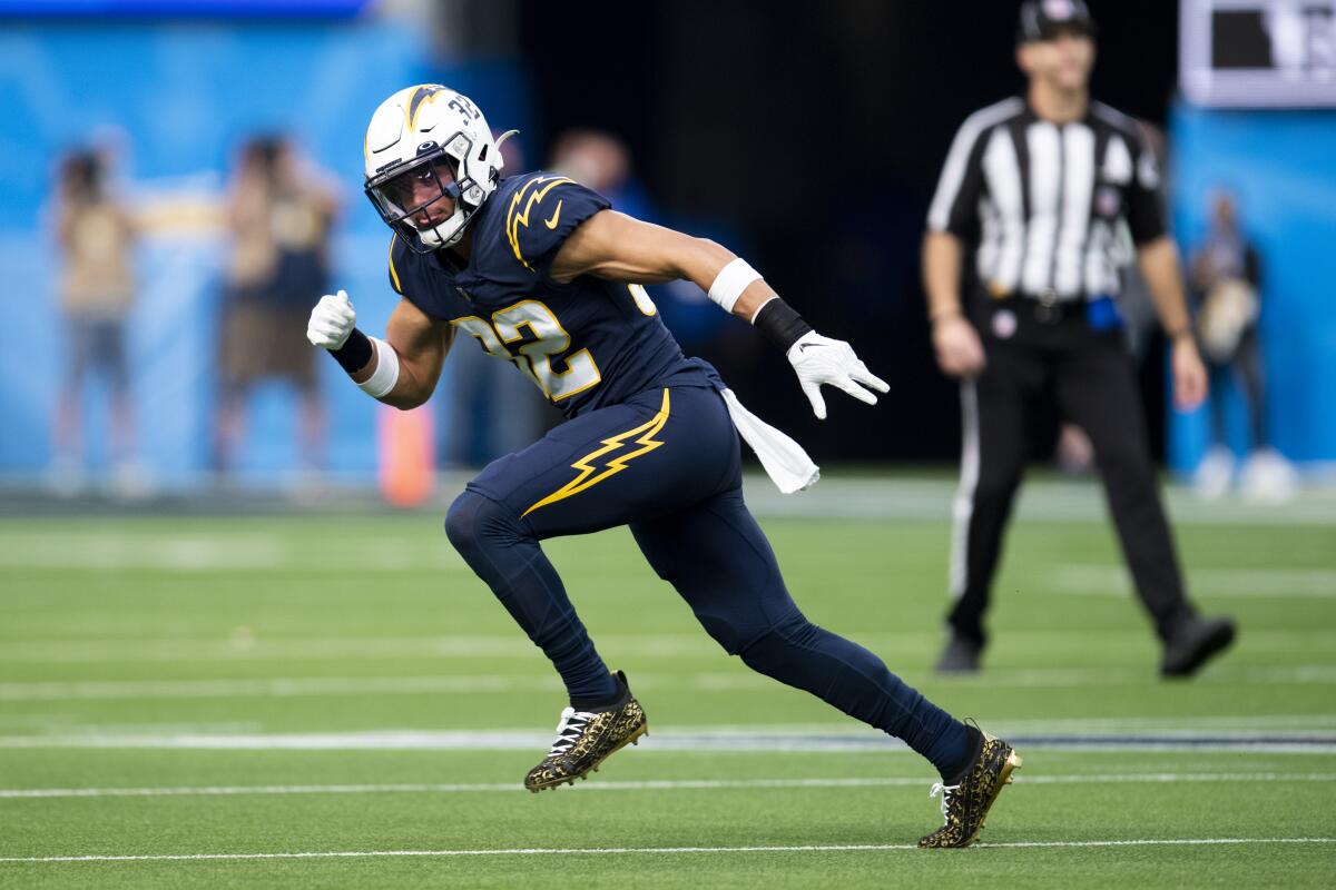 Chargers defensive back Alohi Gilman runs during a game.