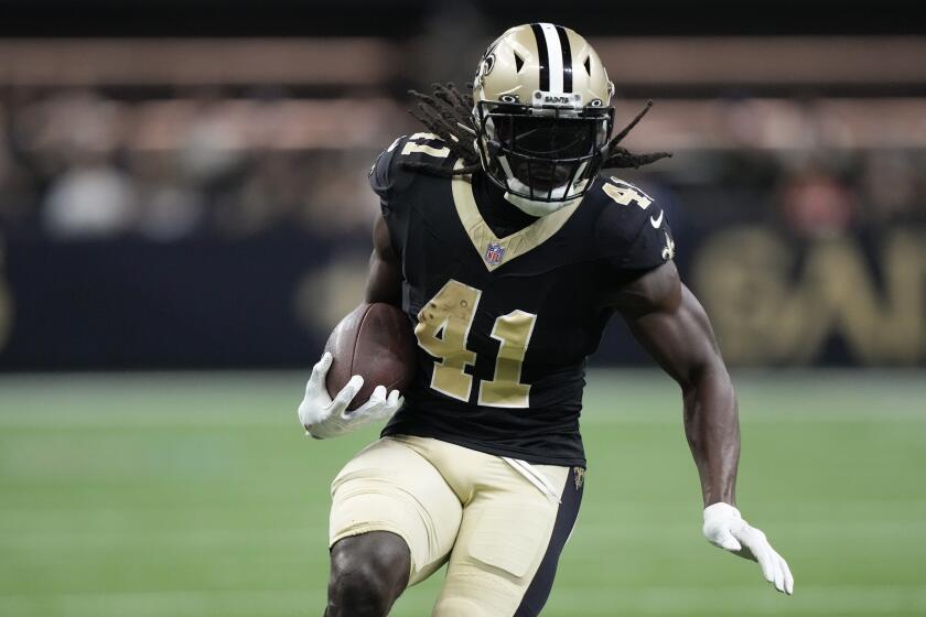 FILE - New Orleans Saints running back Alvin Kamara runs the ball during the first half of the team's preseason NFL football game against the Kansas City Chiefs in New Orleans, Aug. 13, 2023. Kamara is back this week after serving a three-game suspension in connection with his arrest in a February 2022 melee in a casino hotel in Las Vegas. (AP Photo/Gerald Herbert, File)