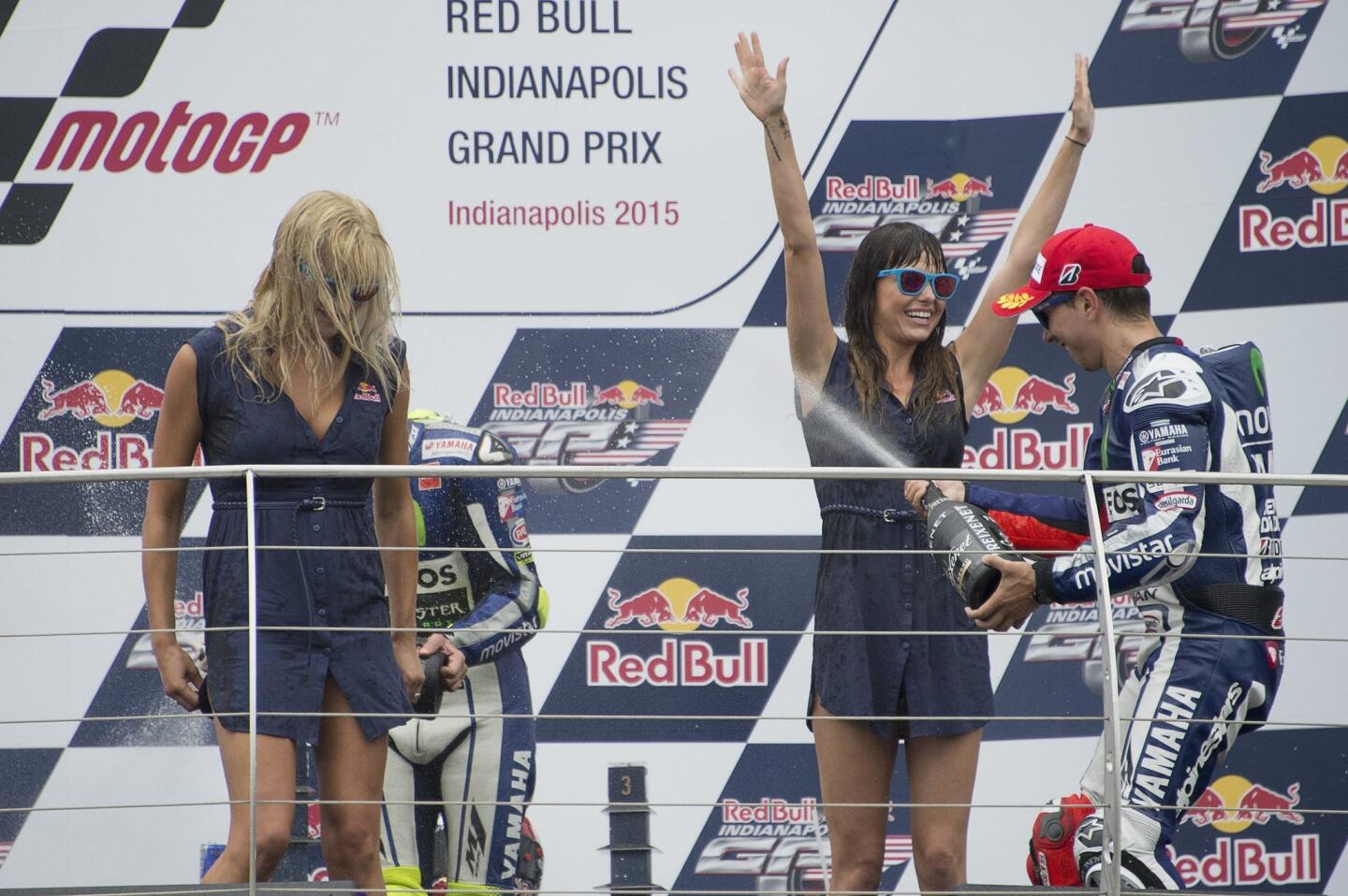 INDIANAPOLIS, IN - AUGUST 09: Jorge Lorenzo of Spain and Movistar Yamaha MotoGP celebrates the second place on the podium with the girls at the end of the MotoGP race during the MotoGp Red Bull U.S. Indianapolis Grand Prix - Race at Indianapolis Motor Speedway on August 9, 2015 in Indianapolis, Indiana. (Photo by Getty Images/Getty Images) ** OUTS - ELSENT, FPG - OUTS * NM, PH, VA if sourced by CT, LA or MoD **