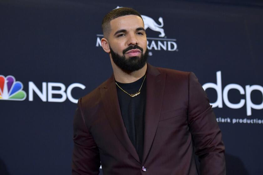 FILE - Drake poses at the Billboard Music Awards in Las Vegas on May 1, 2019. Police are investigating a shooting outside rapper Drake’s mansion that left a security guard seriously wounded. Authorities did not confirm whether Drake was at home at the time of the shooting, but said his team is cooperating. The shooting happened around 2 a.m. Tuesday in the affluent Bridle Path neighborhood of Toronto. (Photo by Richard Shotwell/Invision/AP, File)