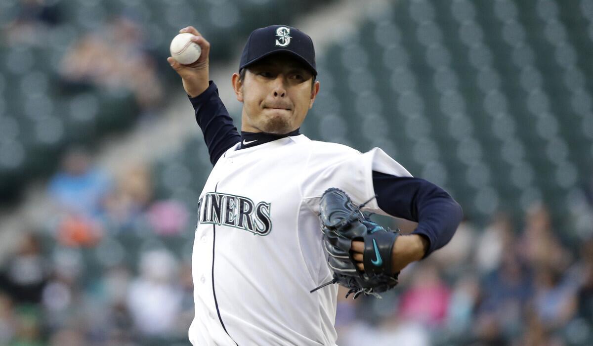 Seattle Mariners starting pitcher Hisashi Iwakuma pitches against the Houston Astros on Monday. Iwakuma was placed on the 15-day disabled list on Friday because of a right lat strain.