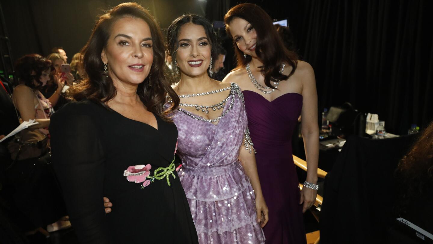 Annabella Sciorra, left, Salma Hayek and Ashley Judd backstage at the 90th Academy Awards on Sunday at the Dolby Theatre in Hollywood.