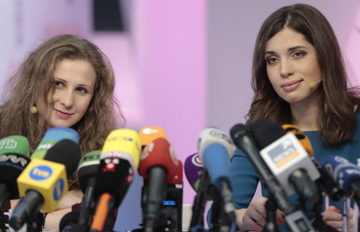 Nadezhda Tolokonnikova, right, and Maria Alekhina, members of the Russian punk band Pussy Riot, at a news conference Dec. 27 after their release from prison.