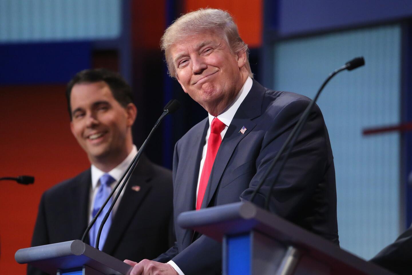 Republican candidates Donald Trump and Wisconsin Gov. Scott Walker participate in the first prime-time presidential debate of the 2016 campaign on Aug. 6, 2015, in Cleveland.