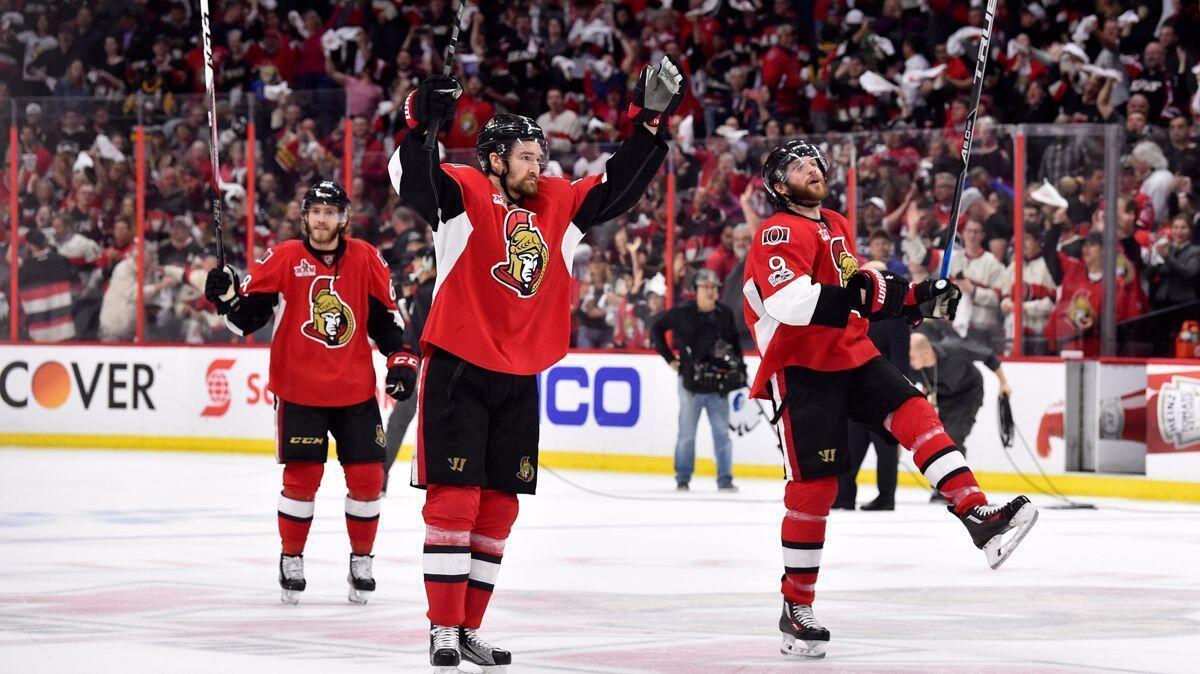 Ottawa Senators' Chris Wideman (6) and Bobby Ryan (9) celebrate after defeating the Pittsburgh Penguins in Game 6 of the Eastern Conference final during the 2017 Stanley Cup playoffs, Tuesday.
