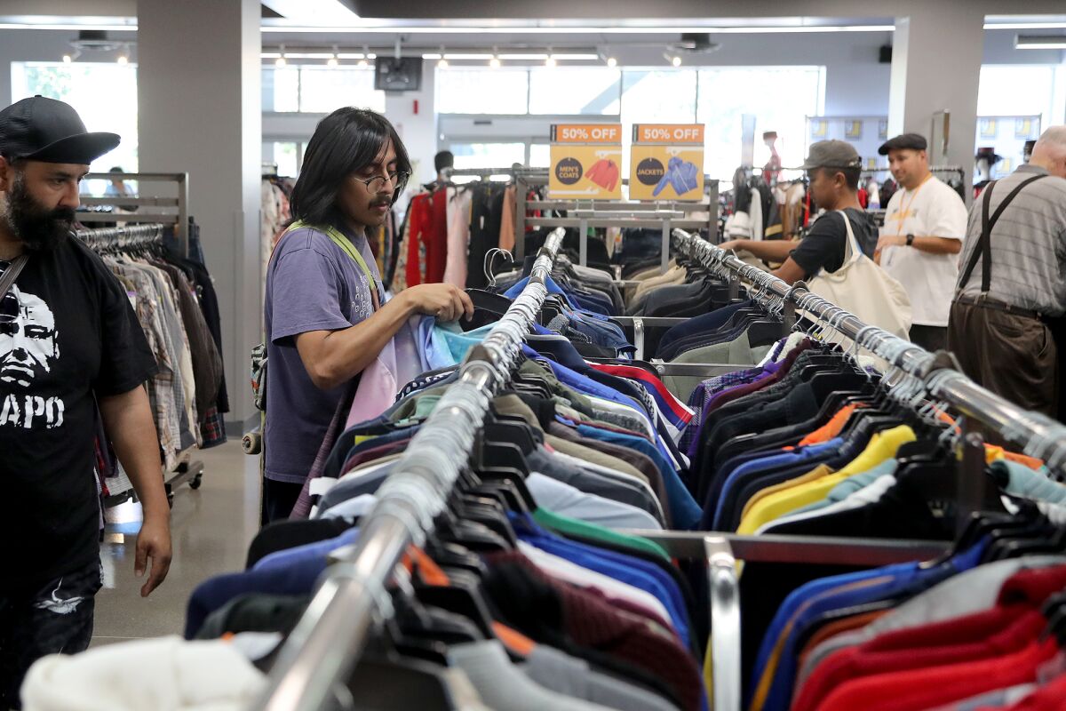 Shoppers browse through men's clothing at Goodwill Orange County in Santa Ana.