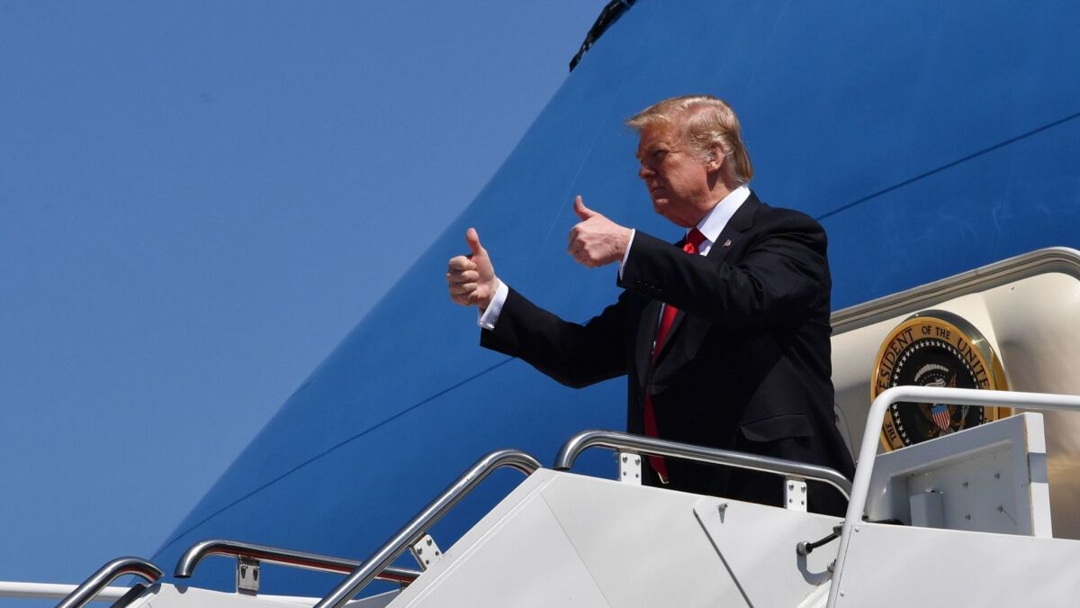 President Trump arrives at Palm Beach International Airport in Florida on Friday.