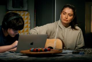 Oren Kinlan and Eve Hewson in "Flora and Son," premiering September 29, 2023 on Apple TV+.