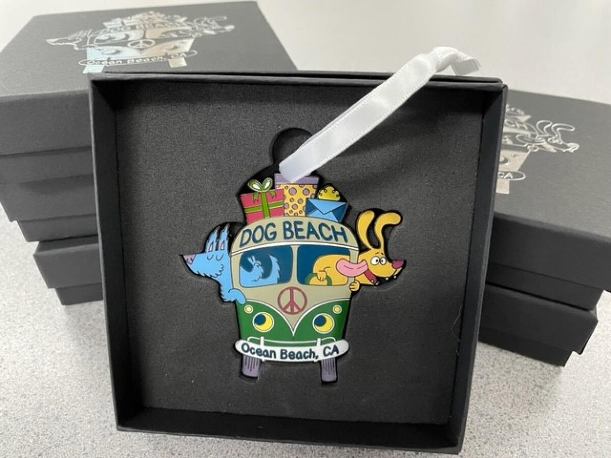 This Ocean Beach holiday ornament features a couple of pups in a Volkswagen van headed to Dog Beach.