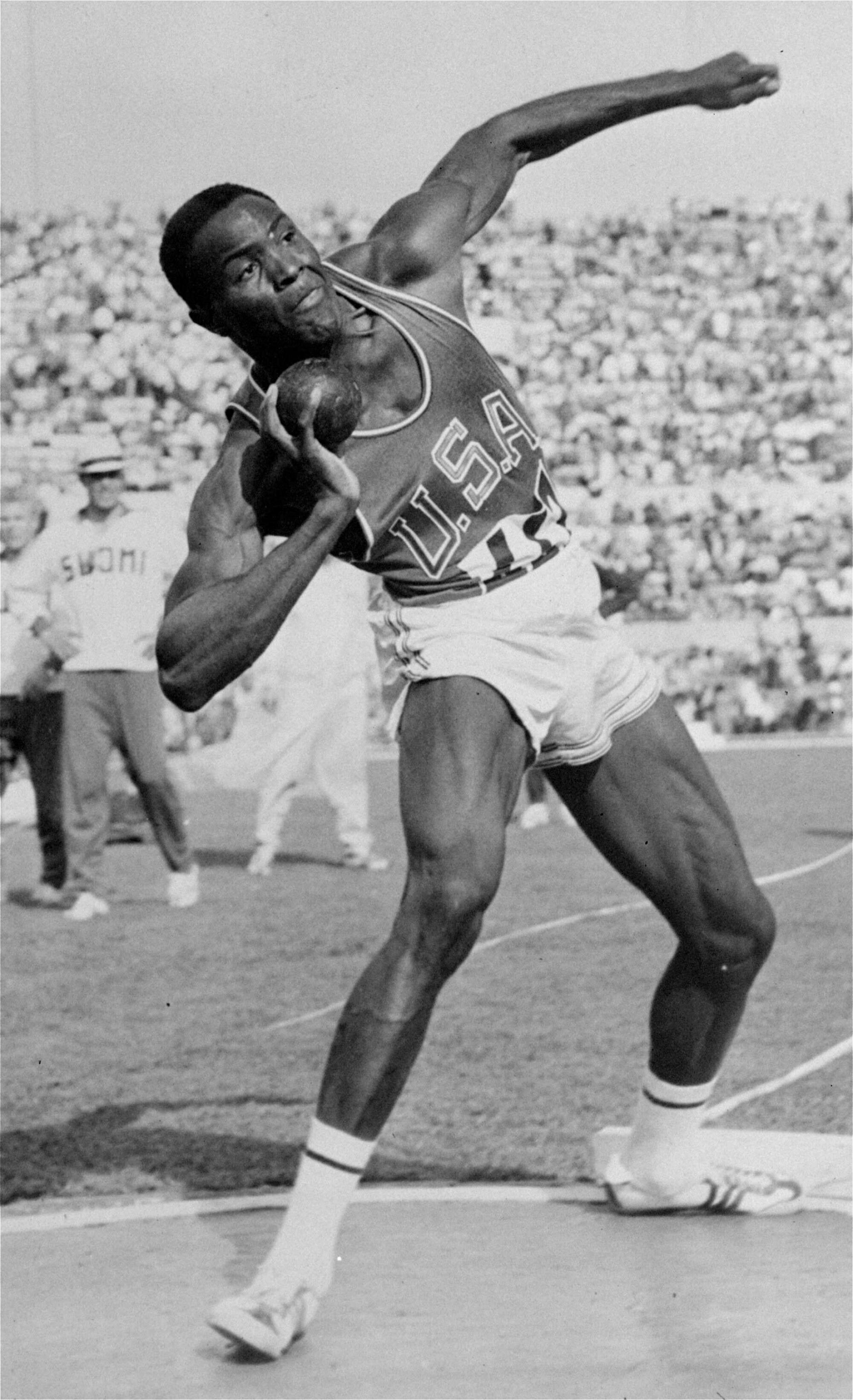 Rafer Johnson competes in the shot put, one of the events in the decathlon, at the 1960 Olympics in Rome.