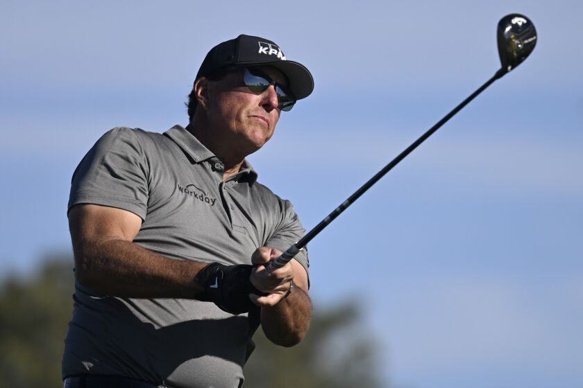 FILE - Phil Mickelson hits his tee shot on the fifth hole of the South Course at Torrey Pines.