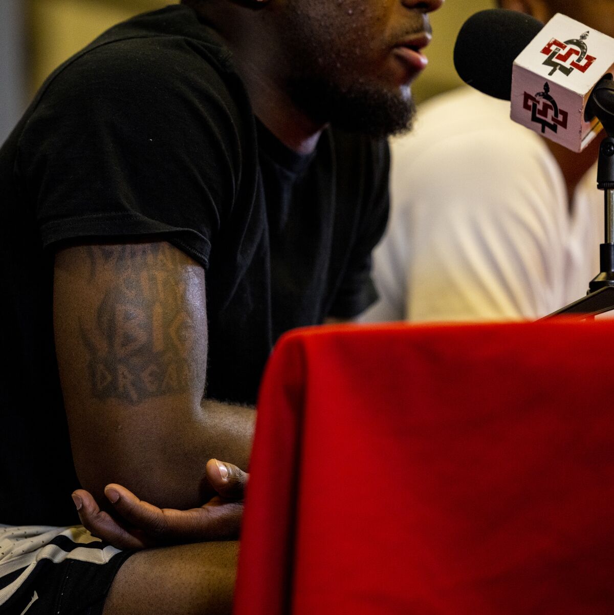 Darrion Trammell has a tattoo on his right bicep reading "Small City Big Dreams"