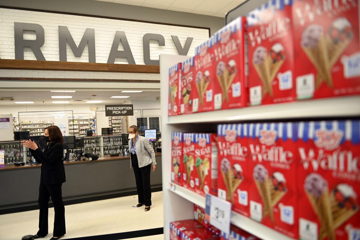 Vice President Kamala Harris visits a pharmacy inside a Giant supermarket in Washington, D.C.