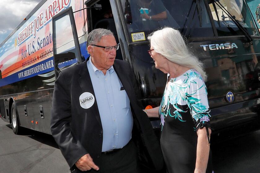 Former Maricopa County Sheriff Joe Arpaio and his wife Ava on the campaign trail in 2018.