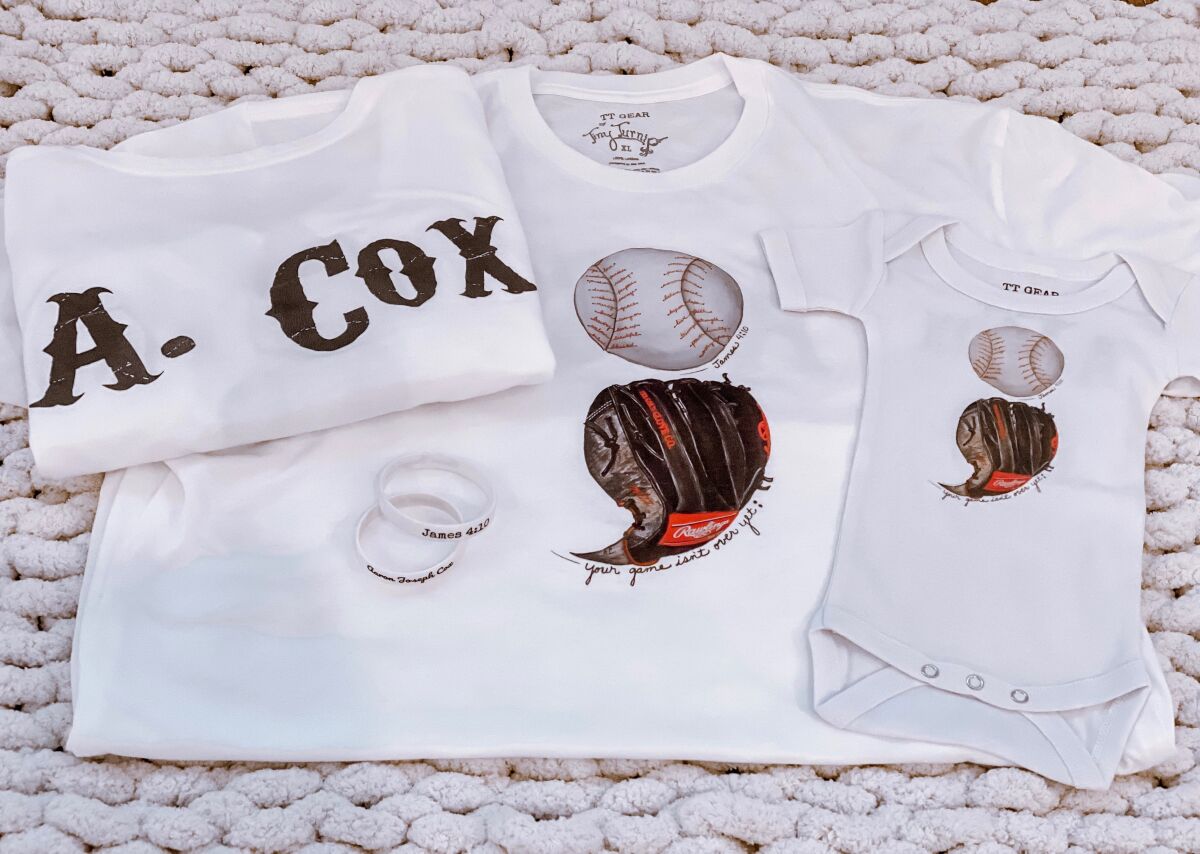 Baby clothing created by Tiny Turnip honoring Aaron Cox.