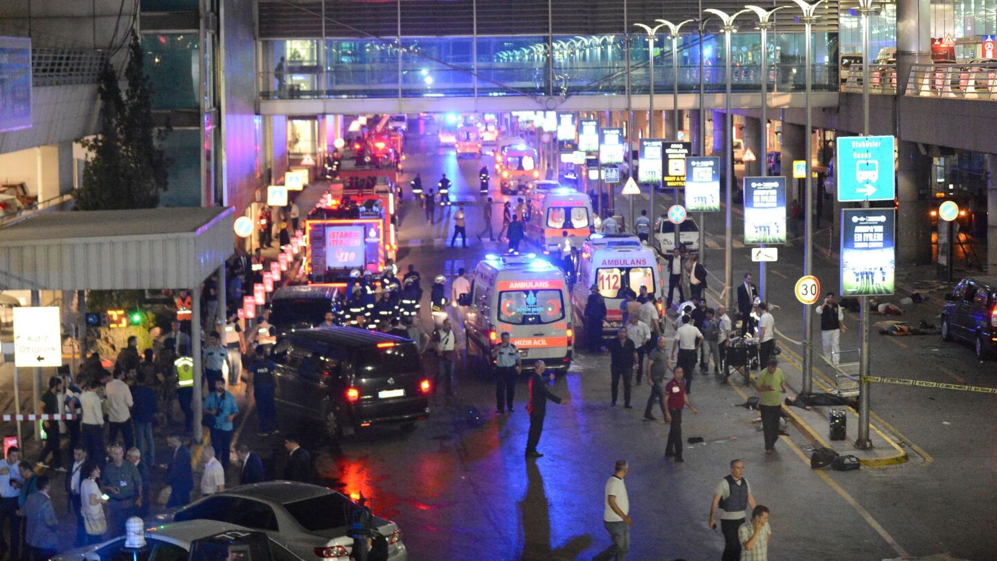Ambulances line up as police set up a perimeter after two explosions rocked Istanbul's Ataturk Airport.