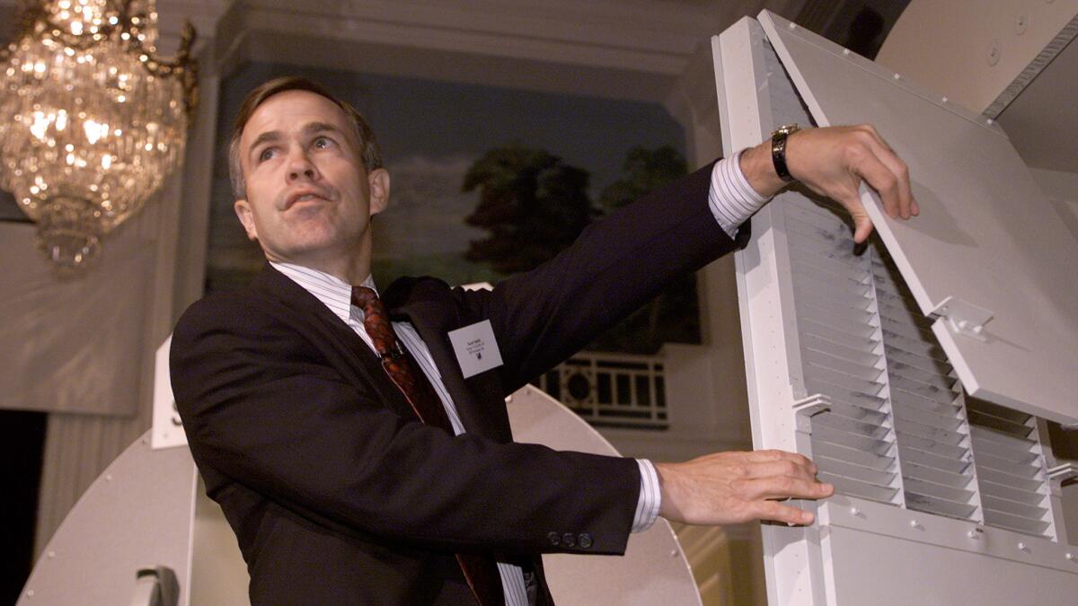 Scott Smith of B/E Aerospace Inc. shows the AeroGuard cockpit security system featuring an anti-ballistic cockpit door in October 2001.