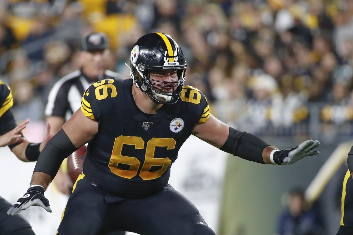 FILE - In this Oct. 28, 2019, file photo, Pittsburgh Steelers offensive guard David DeCastro (66) plays against the Miami Dolphins in an NFL football game in Pittsburgh. DeCastro uses words like "disaster" to describe the Steelers offense in 2019. The veteran Pro Bowl guard is optimistic last year won't repeat itself.(AP Photo/Don Wright, File)