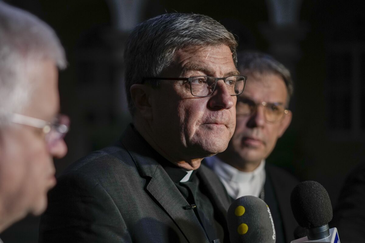 From left, Mons. Olivier Leborgne, Bishop of Arras and Vice-President of the French bishops' conference, Mons. Eric de Moulins-Beaufort, archbishop of Reims and President of the French conference of bishops, and Monsignor Dominique Blanchet, bishop of Creteil, talk to reporters at the end of a press conference, in Rome, Monday, Dec. 13, 2021. Pope Francis agreed Monday to meet with the commission that published a ground-breaking report into clergy sexual abuse in the French Catholic Church and expressed "sadness" over the sudden downfall of the archbishop of Paris, accused of inappropriate relations with a woman and of governance problems. (AP Photo/Andrew Medichini)